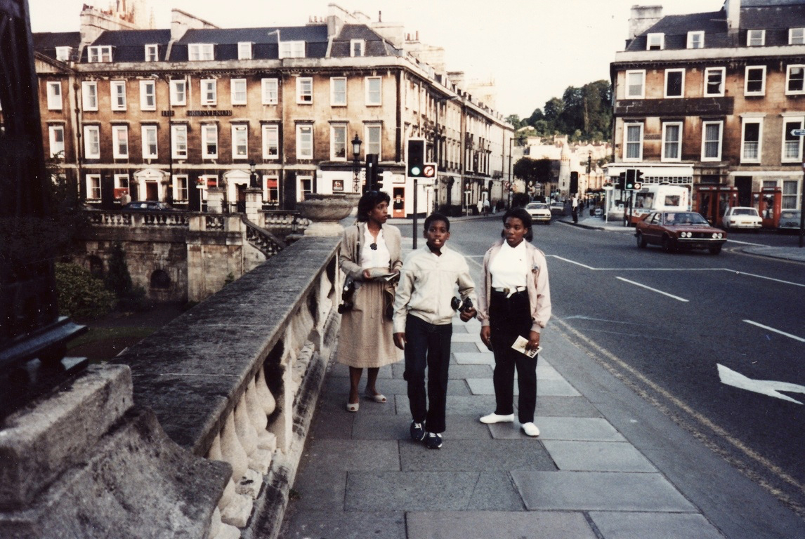 Taking photos on a trip to Bath England with his mother and sister