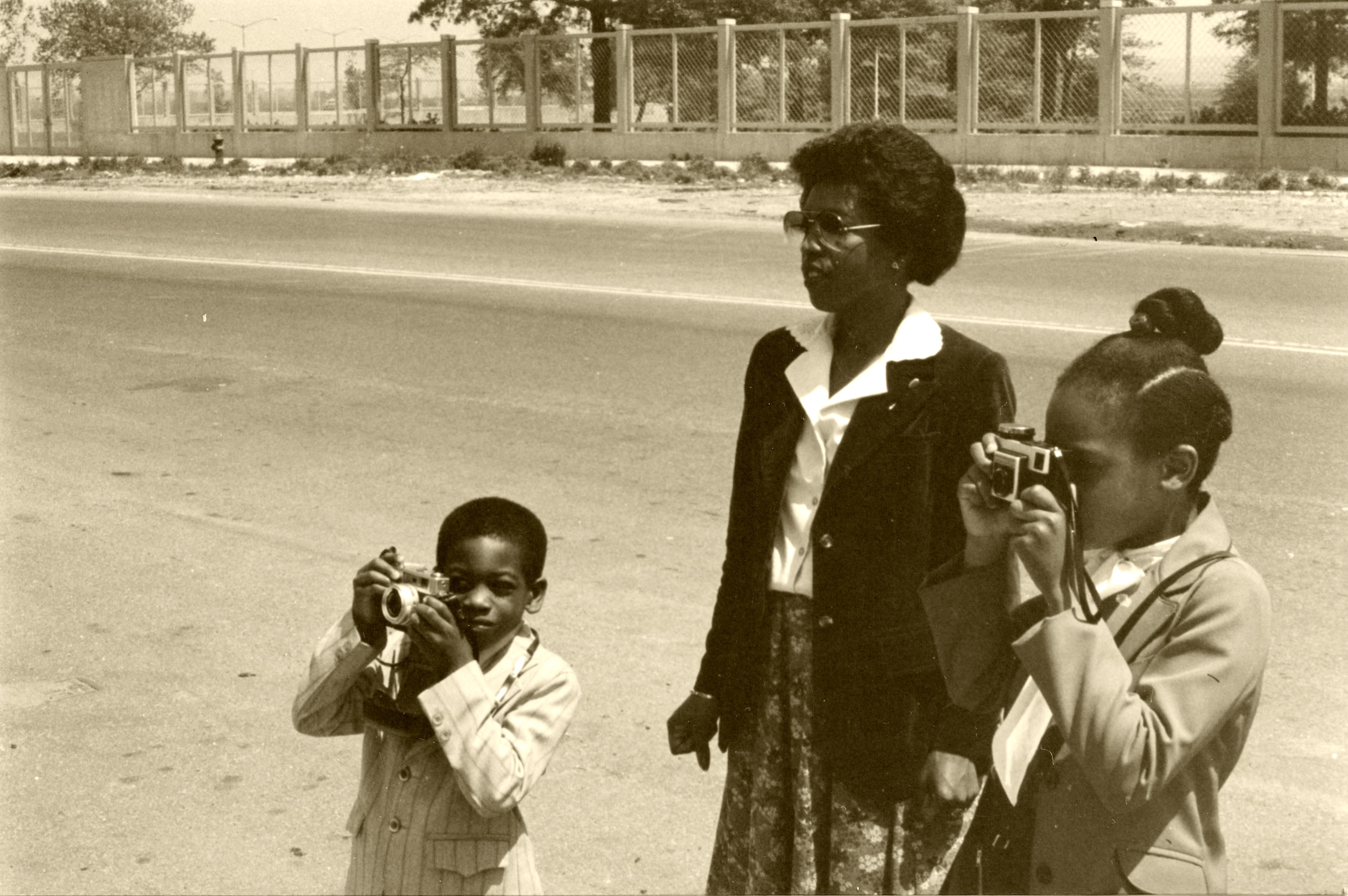 Taking photos with his mother and cousin in New York