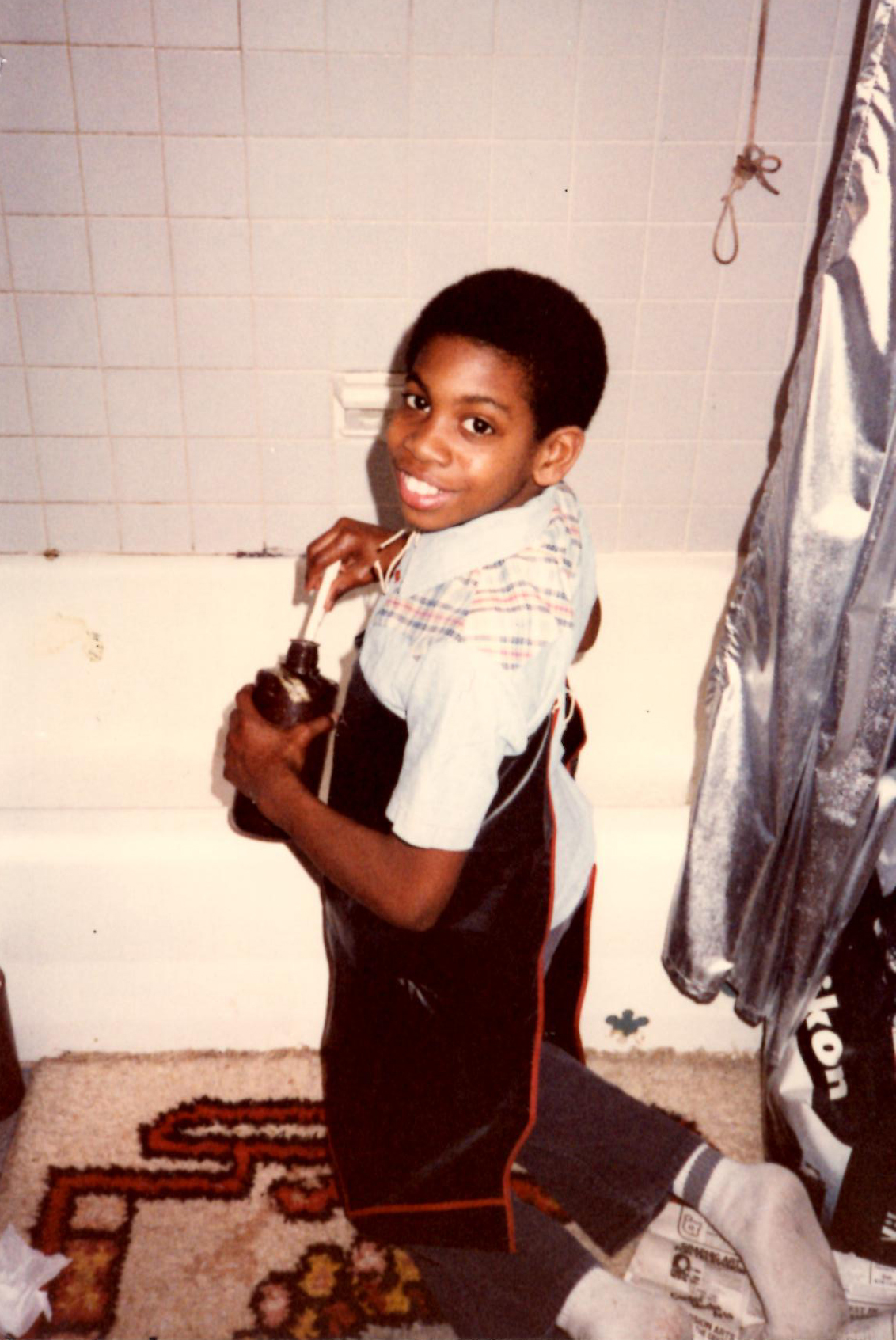 Mixing chemicals for his father's darkroom